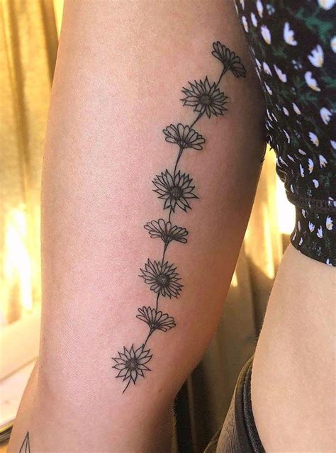 daisy chain tattoo|daisy with butterfly tattoo.